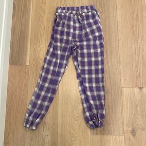 This is a pair of pajama pants that are scrunched at the bottom.